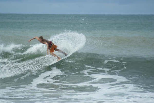 Surfing the Back wash. Osa Peninsula Costa Rica